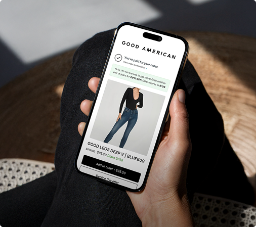 Phone in the hand with ecommerce app.